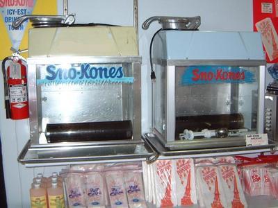 Snow Cone Machine...includes 100 Cups & Straws...and 4 Flavored Syrups.
